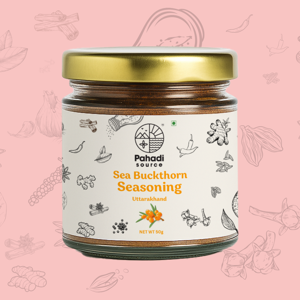 Jar of Pahadi Source Sea Buckthorn Seasoning on a pink background with decorative elements.